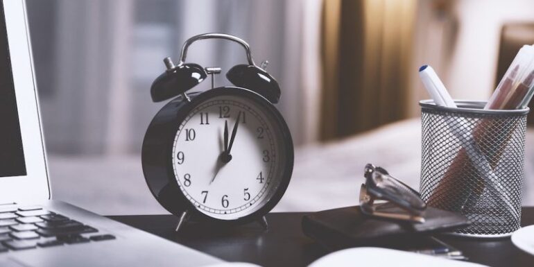 An alarm clock on a desk.