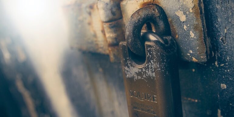 A padlock on a door.