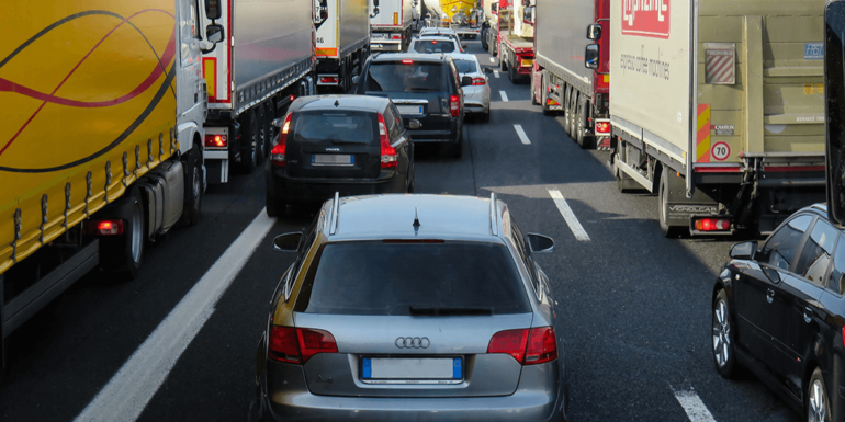 Cars waiting in traffic.