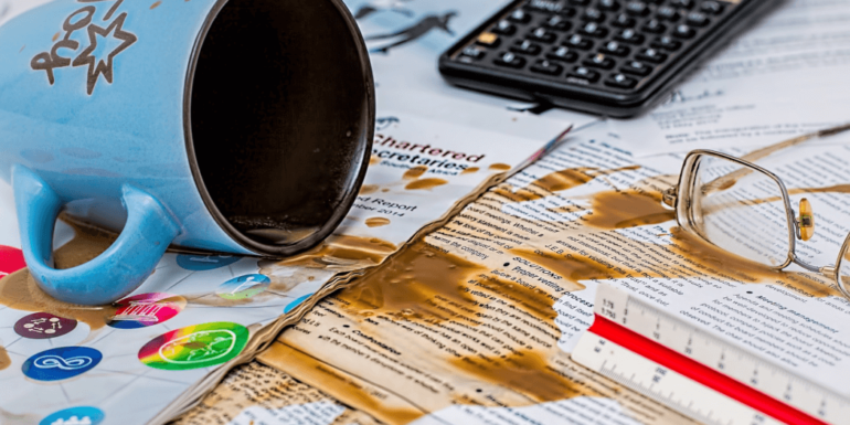 A mug spilling coffee.